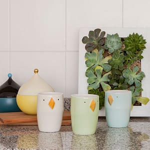 Little ceramic cups of different colors or species